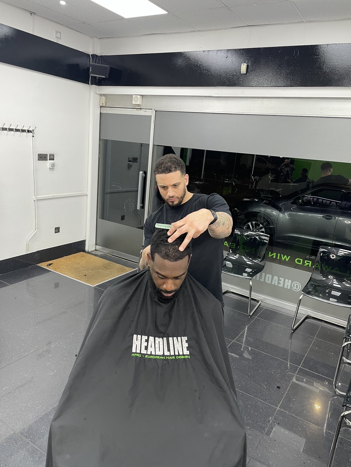 Headline founder cutting a client’s hair in the shop